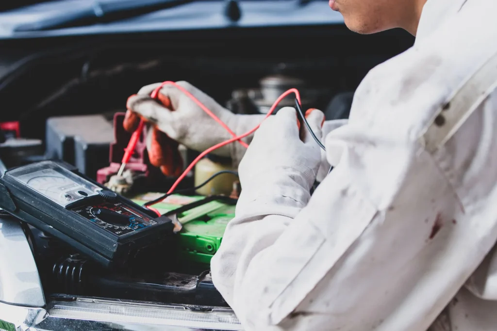 Automotive service area with battery and brake parts illustrating typical repair costs