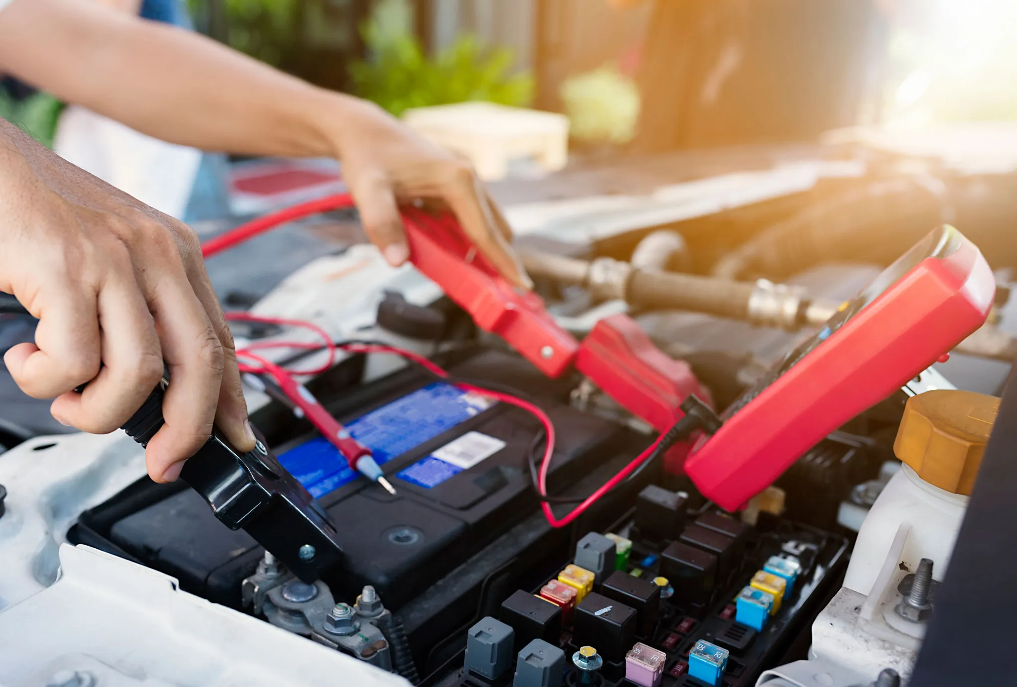 Mechanic's hands with tools, illustrating mobile mechanic services and pricing